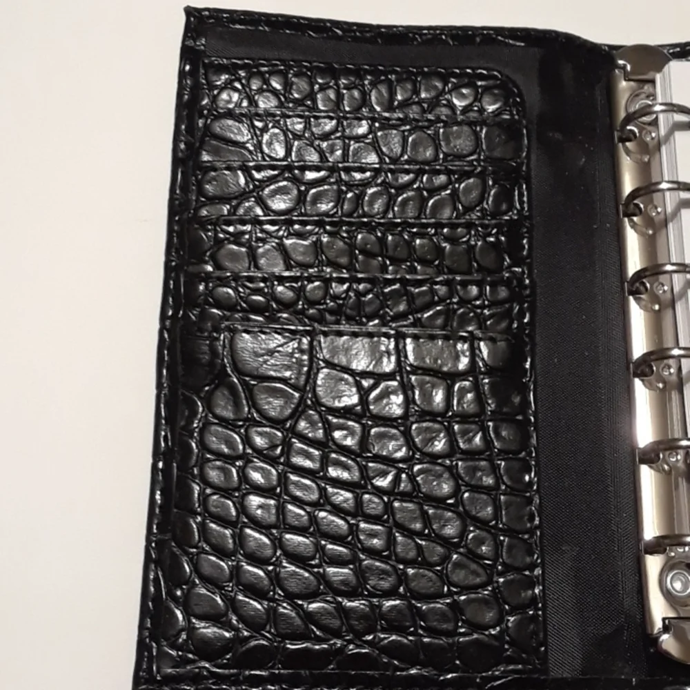 Black 6 ring planner 6.5 x 10.5 Faux leather snake style pattern. New.